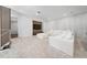 Bright living room boasts a modern white sectional, sleek media console, and contemporary design elements at 8085 Ludington Cir, Orlando, FL 32836