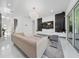 Open living room with marble floors, modern lighting, and a sleek entertainment center at 8085 Ludington Cir, Orlando, FL 32836