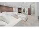 Expansive living area with cozy white sectional, sleek brown accent wall, and stylish decor accents at 8085 Ludington Cir, Orlando, FL 32836