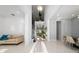 Bright, open-concept room features a soaring ceiling, staircase, and elegant tile flooring at 8085 Ludington Cir, Orlando, FL 32836