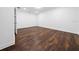 Bright room with hardwood floors, offering a clean and versatile living space at 8085 Ludington Cir, Orlando, FL 32836