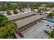 Aerial view showcasing the property's layout, ample parking, and proximity to a pool at 851 Miles Ave # 8, Winter Park, FL 32789