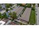 An aerial view showcases a charming complex with a central garden, parking, and a refreshing community pool at 851 Miles Ave # 8, Winter Park, FL 32789