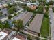 Aerial view highlighting community's layout with convenient parking, green spaces, and a community pool at 851 Miles Ave # 8, Winter Park, FL 32789