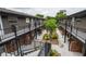 Elevated view of balconies and walkways among lush tropical landscaping at 851 Miles Ave # 8, Winter Park, FL 32789