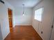 Dining area with hardwood floors, neutral walls, and a window at 851 Miles Ave # 8, Winter Park, FL 32789