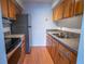 Functional kitchen with stainless steel appliances and wood cabinets at 851 Miles Ave # 8, Winter Park, FL 32789