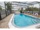 Enclosed pool area featuring lounge chairs and clear blue water at 851 Miles Ave # 8, Winter Park, FL 32789