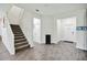 Spacious entryway featuring neutral paint and a staircase leading to the upper level at 8975 Fluffy Lie Ct, Davenport, FL 33896