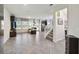 Bright living room featuring hardwood floors, neutral paint, ceiling fan, and comfortable furniture at 8975 Fluffy Lie Ct, Davenport, FL 33896