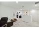 Upstairs loft provides flexible living space with view of an adjacent bathroom at 8975 Fluffy Lie Ct, Davenport, FL 33896
