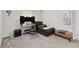 Functional home office space with desk, comfortable seating, and ample room for productivity and relaxation at 8975 Fluffy Lie Ct, Davenport, FL 33896