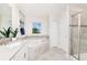 Bright bathroom featuring a soaking tub, separate shower, and a window for natural light at 9106 Cut Shot Dr, Winter Garden, FL 34787