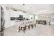 Bright and spacious kitchen featuring stainless steel appliances, a central island, and a dining area at 9106 Cut Shot Dr, Winter Garden, FL 34787