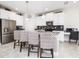 Beautiful kitchen with stainless steel appliances, white cabinets, barstool seating, and a stylish design at 9106 Cut Shot Dr, Winter Garden, FL 34787