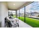 Enclosed lanai with cushioned seating and neighborhood view at 9106 Cut Shot Dr, Winter Garden, FL 34787
