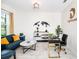 Bright and stylish office space with contemporary furnishings and a world map wall decal at 9106 Cut Shot Dr, Winter Garden, FL 34787