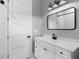 Bathroom featuring vanity with marble countertop, modern fixtures, and a door at 920 Grand Ave, Orange City, FL 32763
