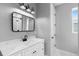 Bathroom vanity with marble countertop, modern fixtures, and shower at 920 Grand Ave, Orange City, FL 32763