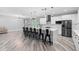 A stylish kitchen with modern appliances, a large island with seating, and an open floor plan, plus lots of natural light at 920 Grand Ave, Orange City, FL 32763