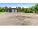 Large outbuilding with two garage doors, offering ample space for storage or workshop at 920 Grand Ave, Orange City, FL 32763
