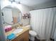 This bathroom has a granite countertop, sink, toilet, and shower at 952 Courtyard Ln # 41, Orlando, FL 32825