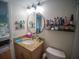 Bathroom featuring granite countertop and a round mirror with vanity lighting at 952 Courtyard Ln # 41, Orlando, FL 32825