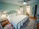 This light and airy bedroom is fully furnished with hardwood floors and an ensuite bathroom at 952 Courtyard Ln # 41, Orlando, FL 32825
