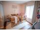 Cozy bedroom featuring two wooden cribs, natural light, and a playful decor, ideal for young children at 952 Courtyard Ln # 41, Orlando, FL 32825