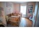This Bedroom is equipped with multiple cribs and a large storage unit at 952 Courtyard Ln # 41, Orlando, FL 32825