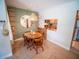 Dining area featuring a rustic wooden table and chairs with stylish accents at 952 Courtyard Ln # 41, Orlando, FL 32825
