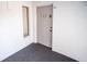 Condo entrance with decorative wreath on door, white walls, and carpeted floor at 952 Courtyard Ln # 41, Orlando, FL 32825