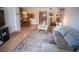 Open living area with modern furnishings and views into dining and kitchen spaces at 952 Courtyard Ln # 41, Orlando, FL 32825