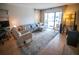 Cozy living room with comfortable seating, neutral decor, and a large window for natural light at 952 Courtyard Ln # 41, Orlando, FL 32825