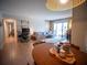 Open-concept living and dining space features ample light, tile flooring, and comfortable furnishings at 952 Courtyard Ln # 41, Orlando, FL 32825