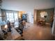 Open-concept living and dining area with large windows at 952 Courtyard Ln # 41, Orlando, FL 32825