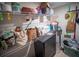 The storage space has white shelving, cleaning supplies and personal items at 952 Courtyard Ln # 41, Orlando, FL 32825