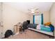 Bedroom with carpet floors, a ceiling fan, desk, and a window for natural light at 9539 Silver Buttonwood St, Orlando, FL 32832