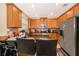 This kitchen showcases stainless steel appliances, granite counters, and light wood cabinets with a modern feel at 9539 Silver Buttonwood St, Orlando, FL 32832