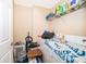 Laundry room featuring a washing machine and dryer, as well as shelving for storage at 9539 Silver Buttonwood St, Orlando, FL 32832