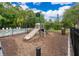 Neighborhood playground featuring a slide with a black metal fence at 9539 Silver Buttonwood St, Orlando, FL 32832