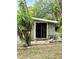 Private backyard features a patio with mature landscaping, perfect for outdoor relaxation at 10301 Us Highway 27 # 34, Clermont, FL 34711