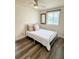 Bright bedroom with a comfortable bed, modern ceiling fan, and a window providing natural light at 10301 Us Highway 27 # 34, Clermont, FL 34711