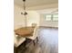 Inviting dining room with a wooden table, chandelier lighting, and an open layout to the living area at 10301 Us Highway 27 # 34, Clermont, FL 34711