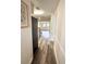 Hallway features modern flooring and neutral walls leading to dining and living spaces at 10301 Us Highway 27 # 34, Clermont, FL 34711