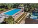 Aerial view of a community pool, surrounded by lush landscaping at 10301 Us Highway 27 # 34, Clermont, FL 34711