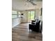 Cozy sun room with ample natural light, modern flooring, and comfortable seating at 10301 Us Highway 27 # 34, Clermont, FL 34711