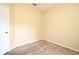 Bedroom with beige carpet, base molding, and light yellow walls at 1086 Wickerwood St, Ocoee, FL 34761
