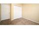 This empty bedroom features carpet, a double door closet, neutral paint, and a blank canvas at 1086 Wickerwood St, Ocoee, FL 34761