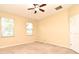 Bright bedroom featuring carpeted floors, two windows, and a ceiling fan, offering a comfortable living space at 1086 Wickerwood St, Ocoee, FL 34761